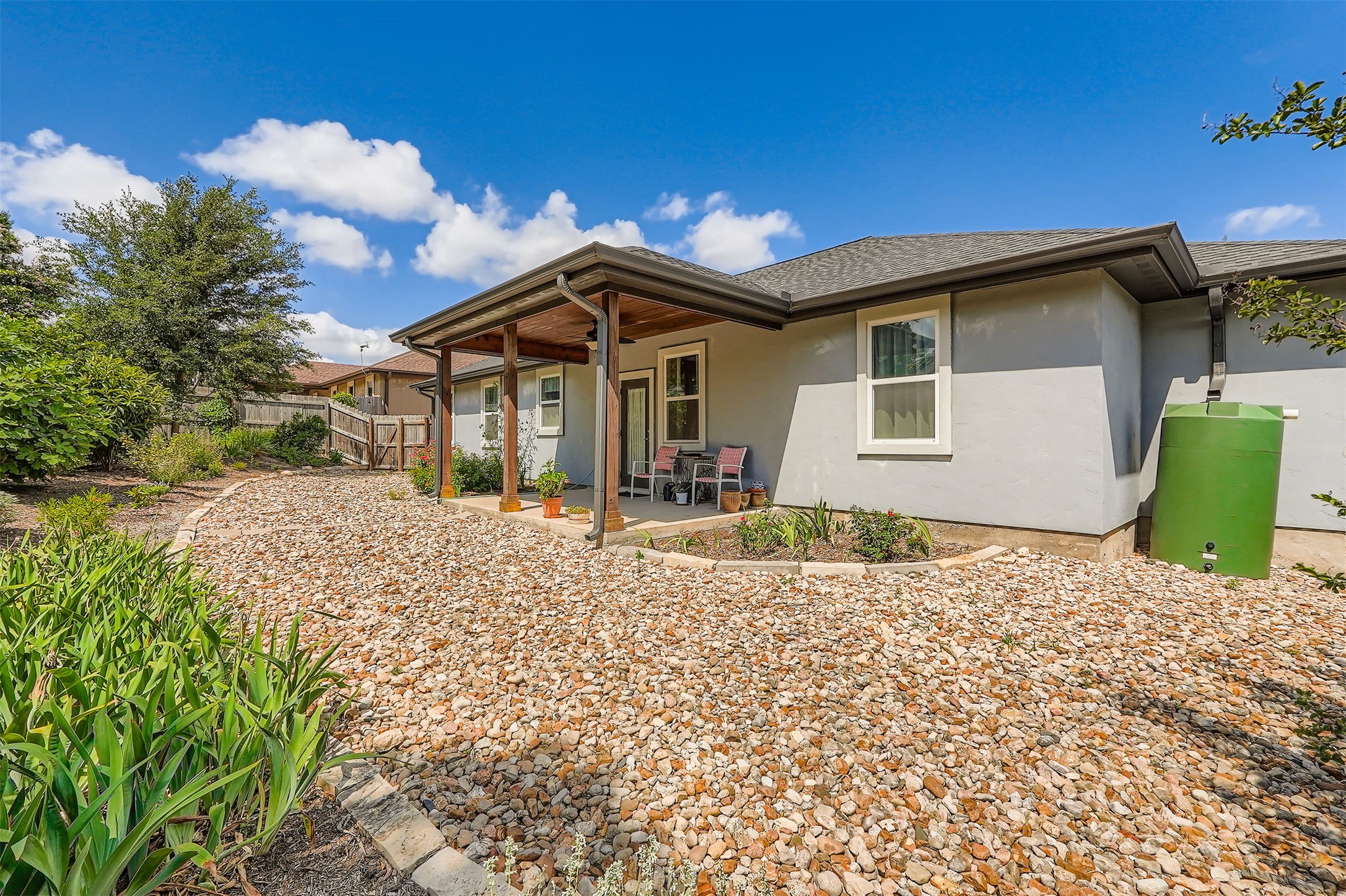5501 Hitching Post Lago Vista, TX 78645 - Photo 25 of 26 a front view of a house with a yard