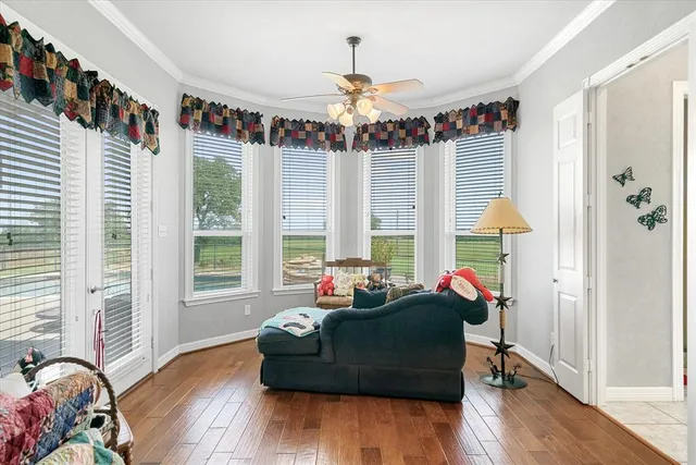 a very nice looking kitchen with a large window appliances and furniture