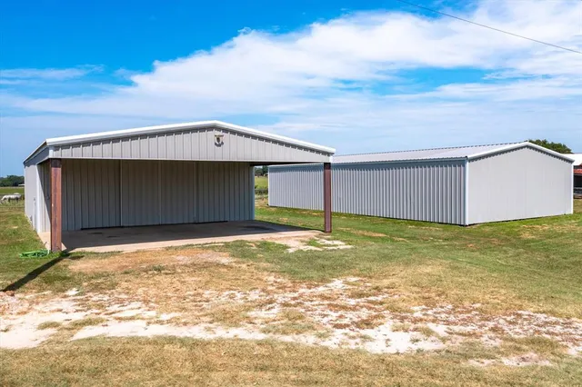 a front view of house with a garden
