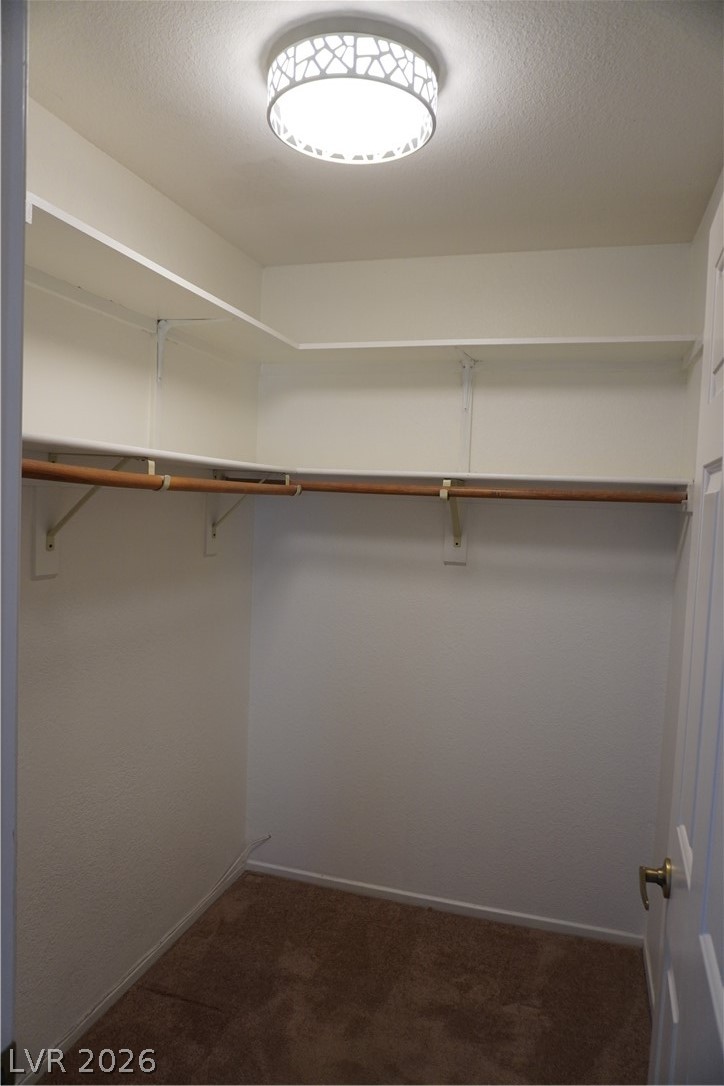 8328 Del Rey Avenue Las Vegas, NV 89117 - Photo 26 of 38 Ample shelving and hanging space defines this well-organized walk-in closet, ready for your wardrobe.