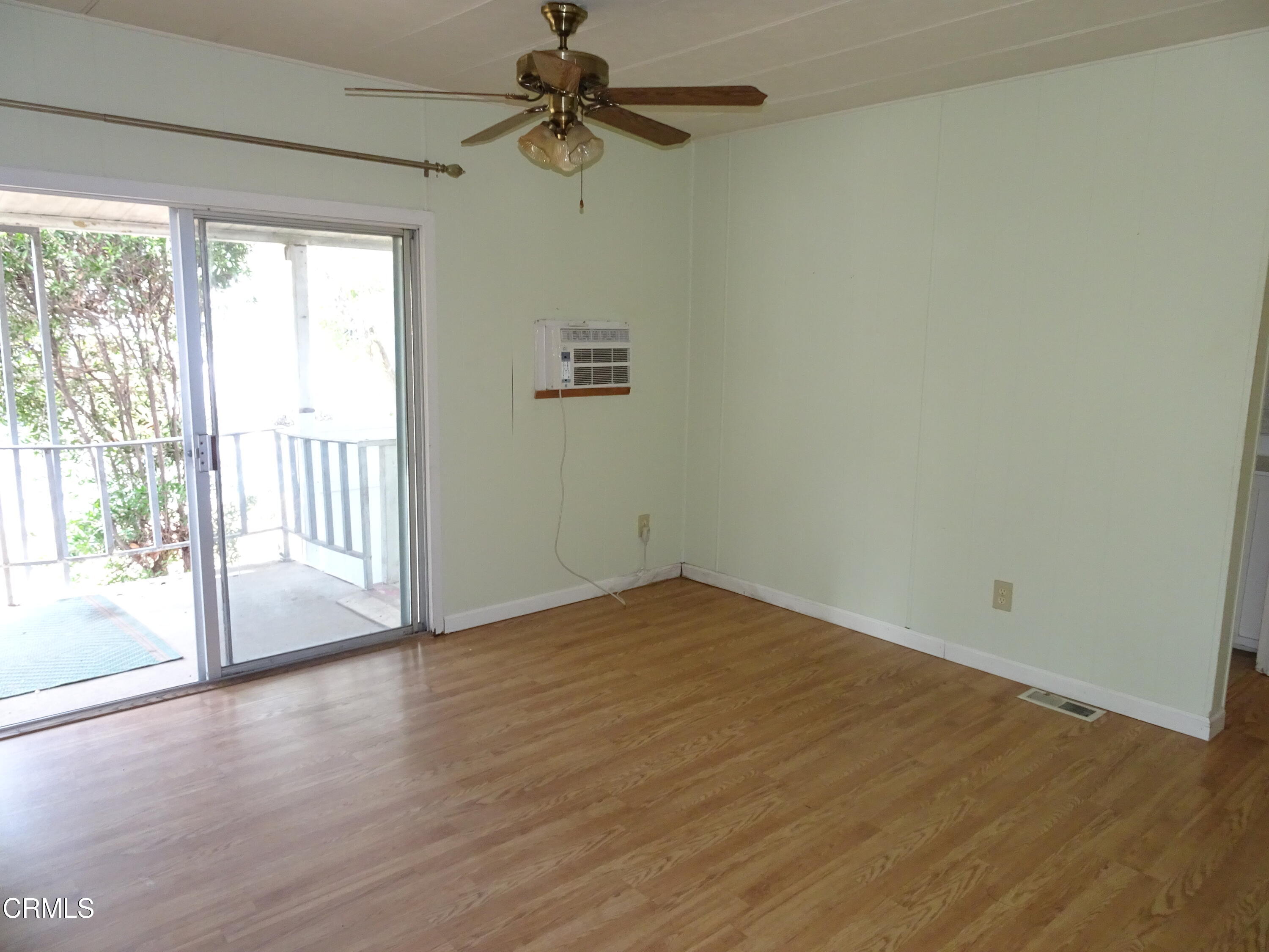 1225 South Rice Road, Unit 28 Ojai, CA 93023 - Photo 18 of 27 a view of empty room with wooden floor and fan