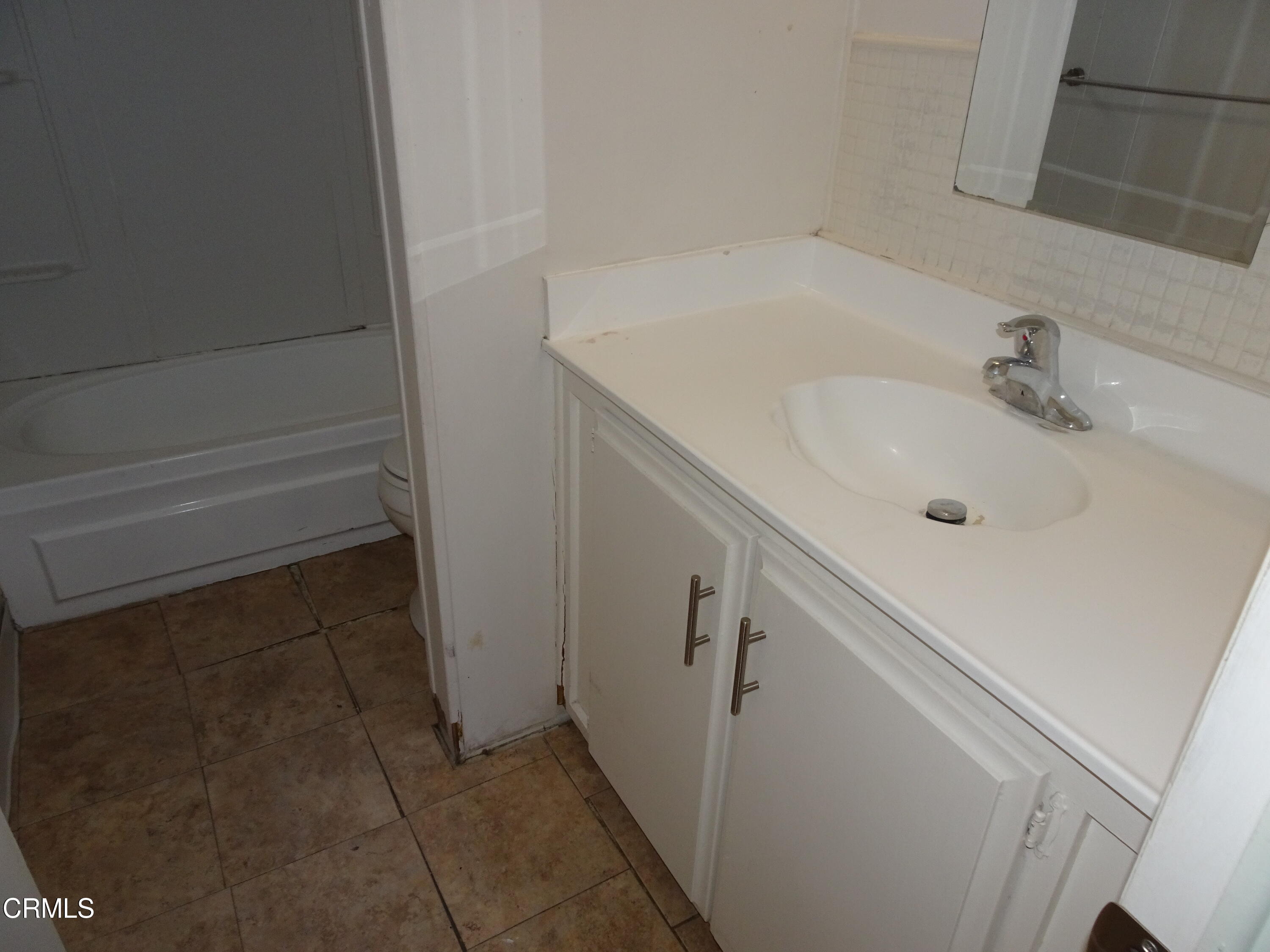 1225 South Rice Road, Unit 28 Ojai, CA 93023 - Photo 21 of 27 a bathroom with a sink and mirror