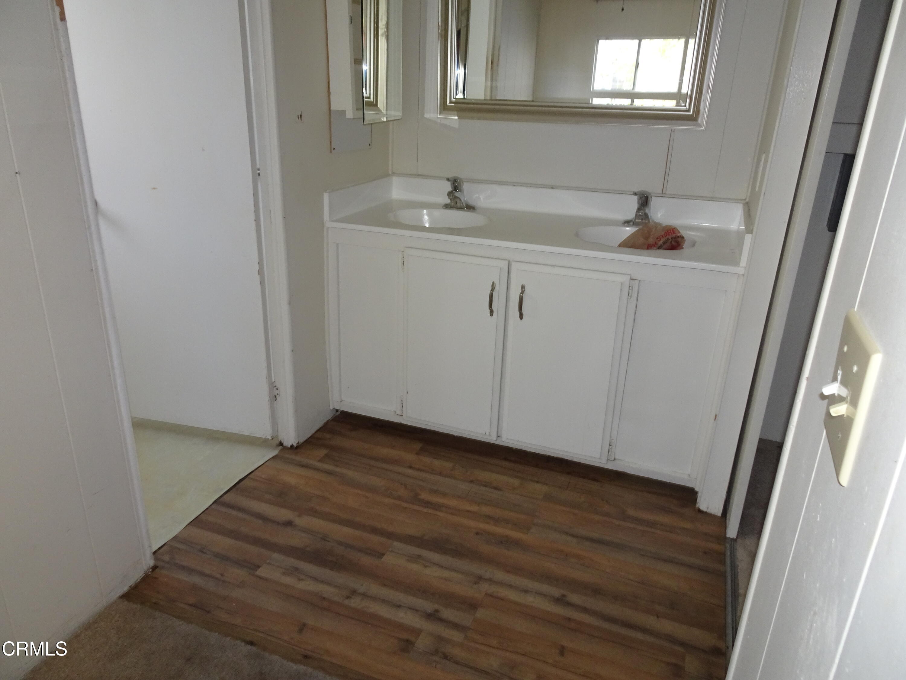 1225 South Rice Road, Unit 28 Ojai, CA 93023 - Photo 25 of 27 a bathroom with a sink and a mirror