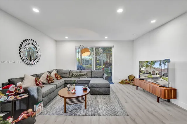 a living room with furniture and a large window