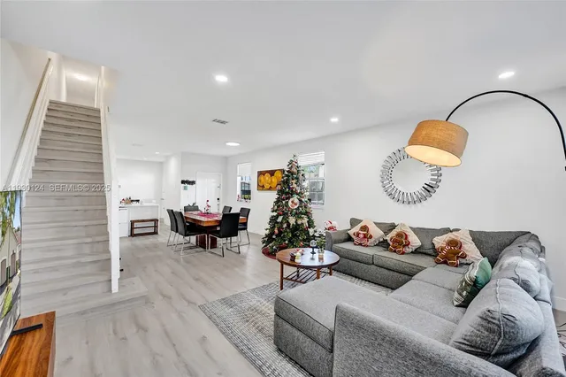 a living room with furniture and window