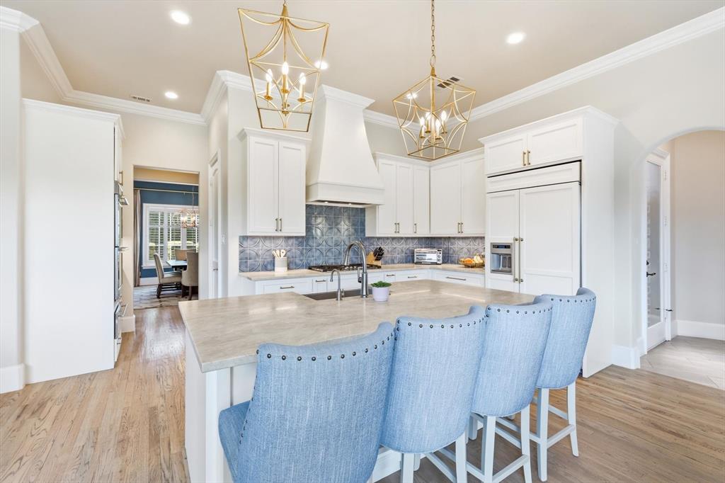 476 Hidden Valley Lane Coppell, TX 75019 - Photo 9 of 40 a large kitchen with granite countertop lots of counter space and stainless steel appliances