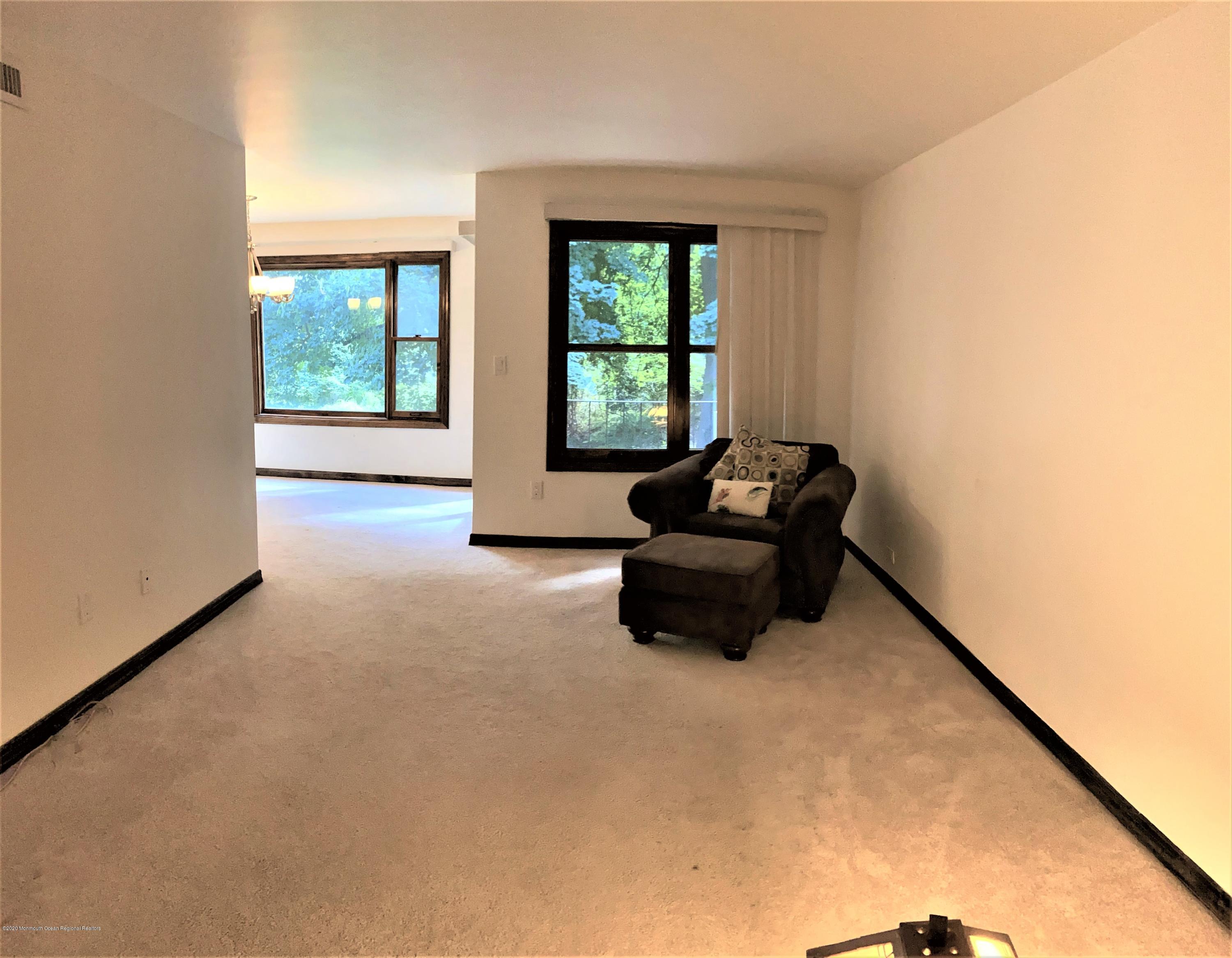 200 Portland Road, Unit D20 Highlands, NJ 07732 - Photo 3 of 10 a living room with furniture and a window