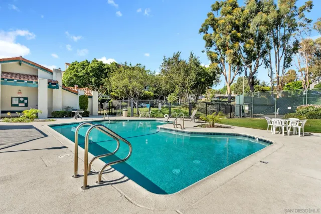 a view of a swimming pool with a patio