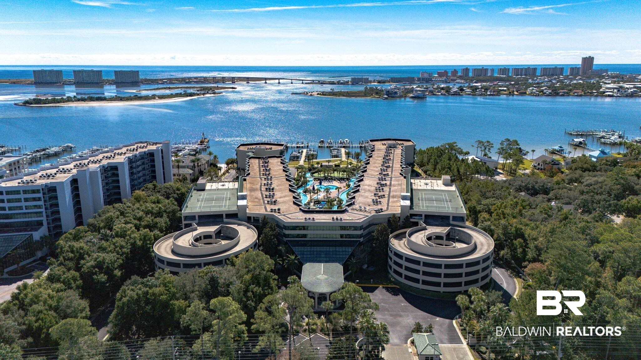 27580 Canal Road, Unit 1526 Orange Beach, AL 36561 - Photo 2 of 49 View of urban area featuring a nearby body of water and numerous boat docks
