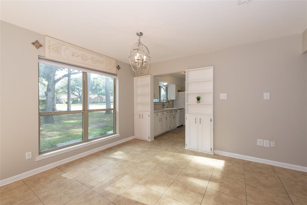 2124 Ridge Lane Grapevine, TX 76051 - Photo 13 of 23 a view of a kitchen with refrigerator and sink