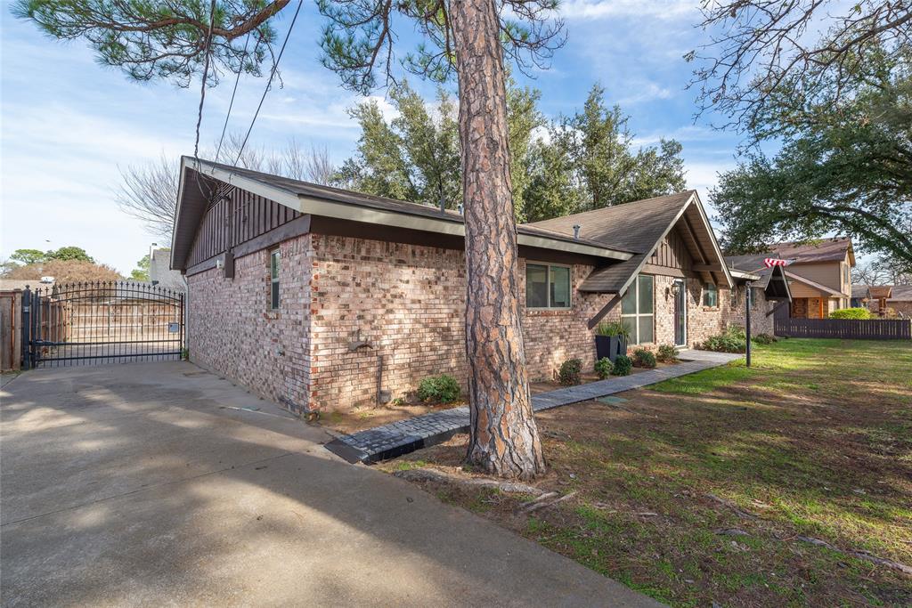 2124 Ridge Lane Grapevine, TX 76051 - Photo 20 of 23 a view of a house with a yard