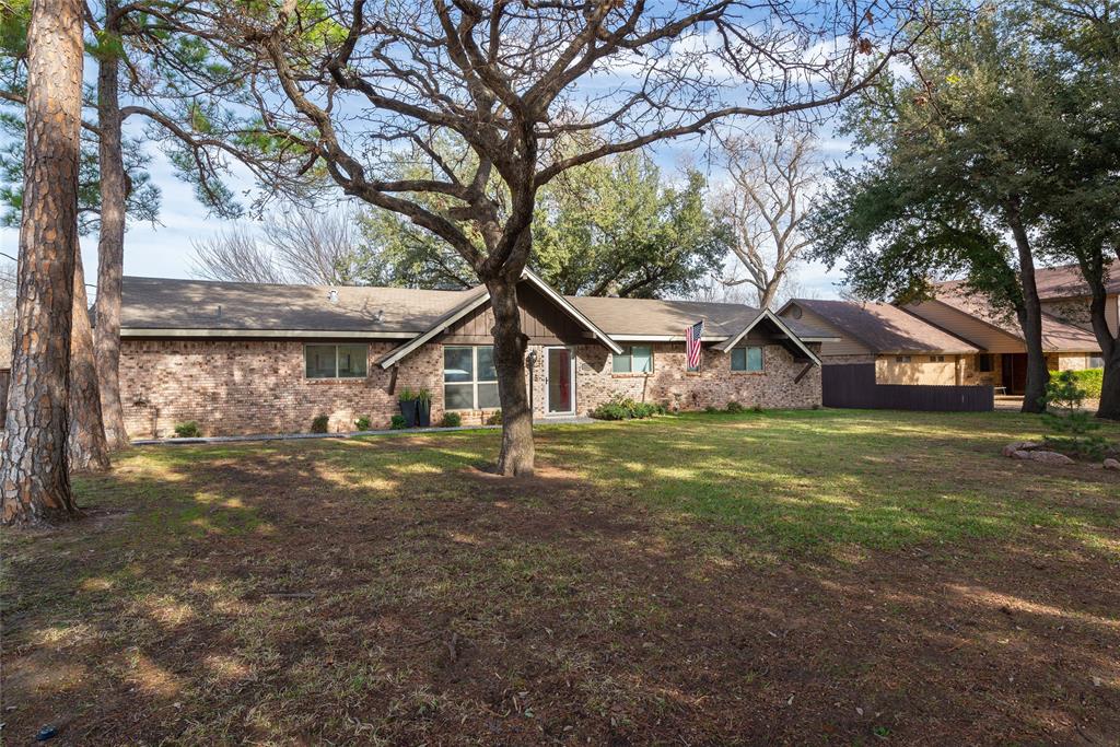2124 Ridge Lane Grapevine, TX 76051 - Photo 23 of 23 a view of a house with a yard