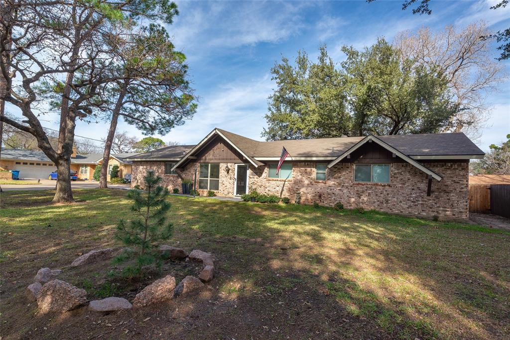 2124 Ridge Lane Grapevine, TX 76051 - Photo 5 of 23 a front view of a house with a yard