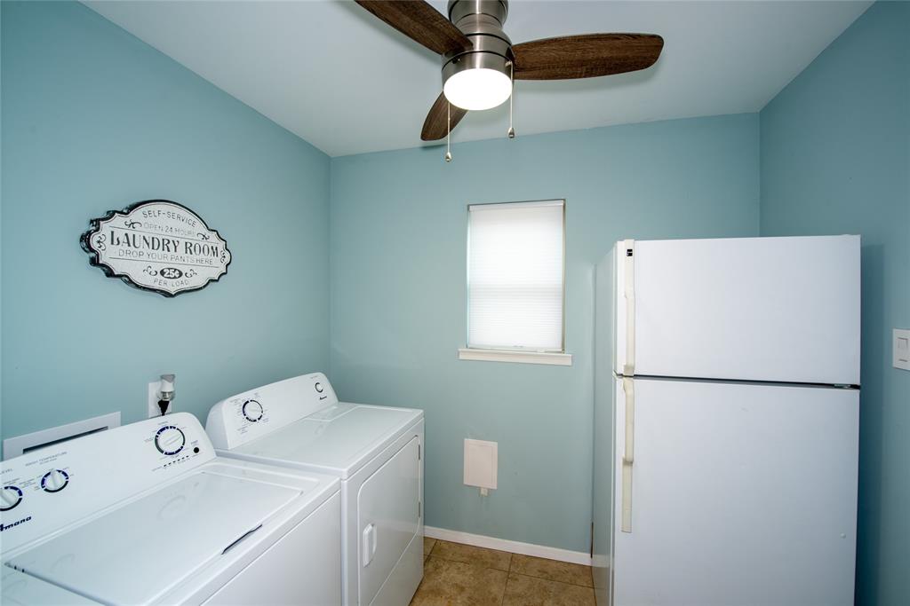 2124 Ridge Lane Grapevine, TX 76051 - Photo 8 of 17 Washroom featuring ceiling fan, light tile patterned flooring, and independent washer and dryer