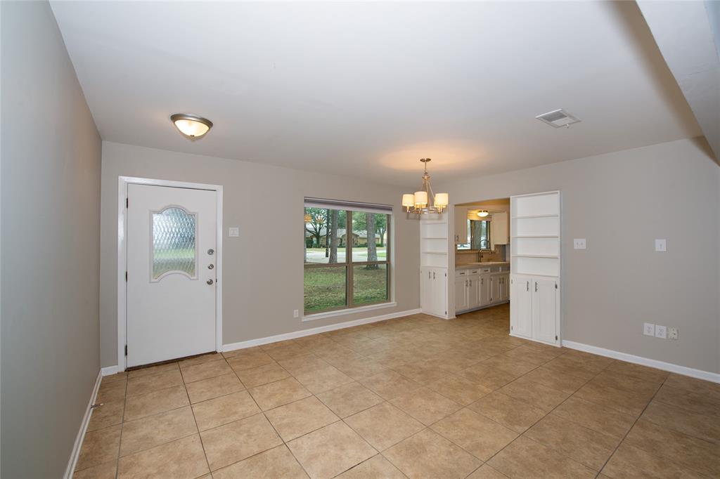 2124 Ridge Lane Grapevine, TX 76051 - Photo 9 of 17 Foyer featuring a chandelier and light tile patterned floors