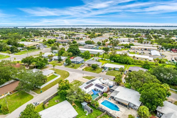 an aerial view of residential houses with outdoor space
