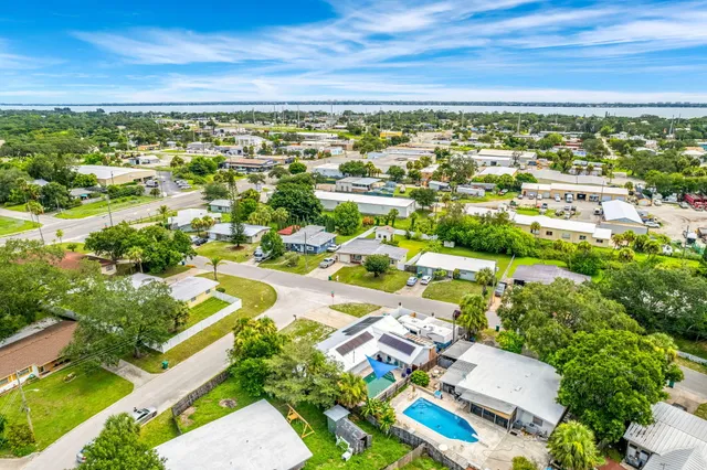 an aerial view of residential houses with outdoor space