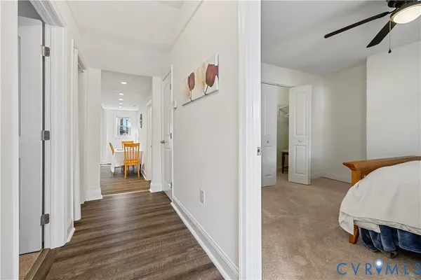 a view of a bedroom and wooden floor