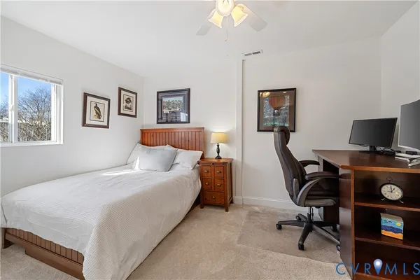 a bedroom with a workspace