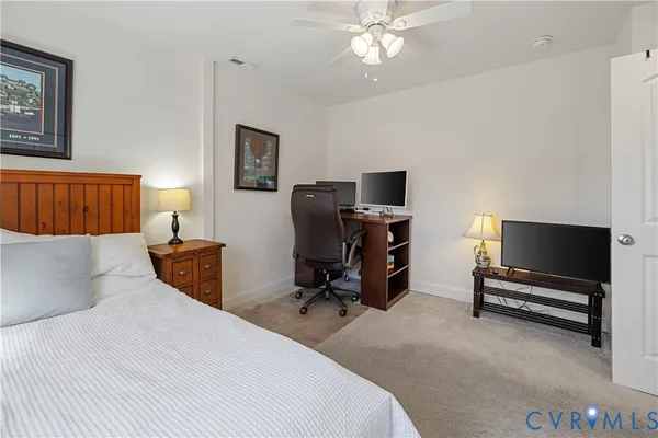 a bedroom with a bed and furniture