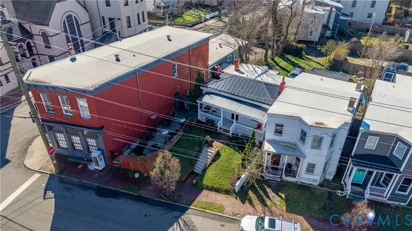 an aerial view of a houses with terrace