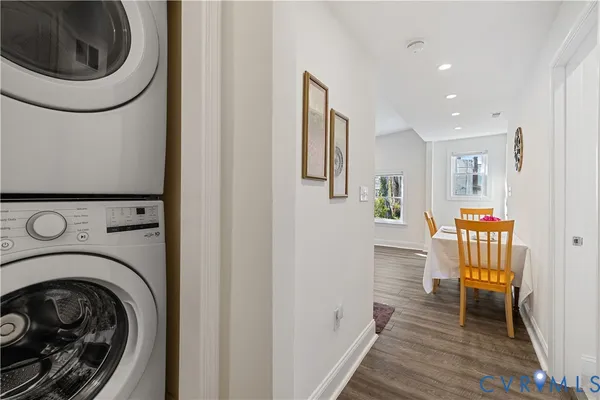a view of a hallway with washer and dryer