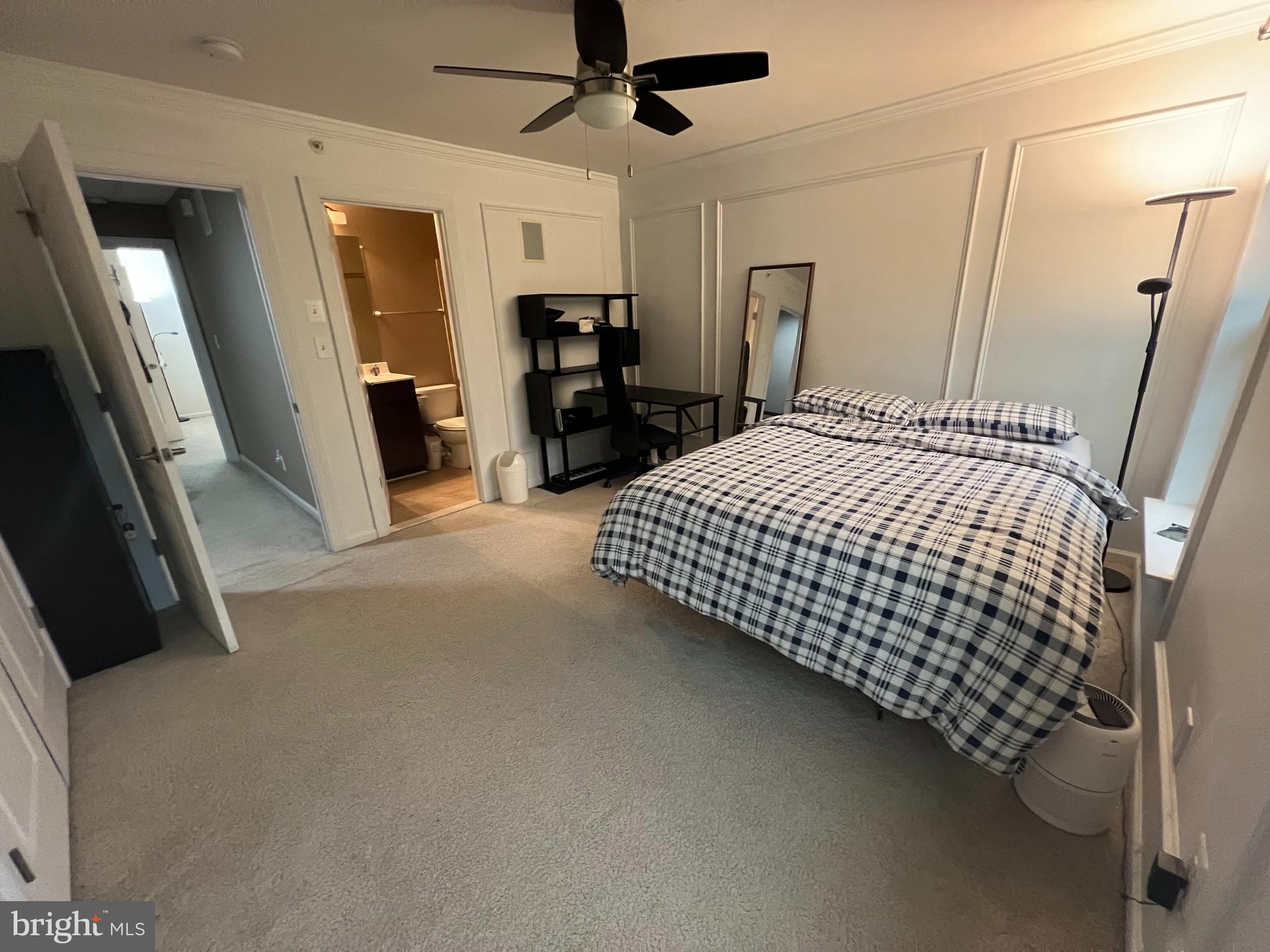 8193 Falls Grove Drive Manassas, VA 20111 - Photo 22 of 27 a bedroom with a bed and dresser with mirror