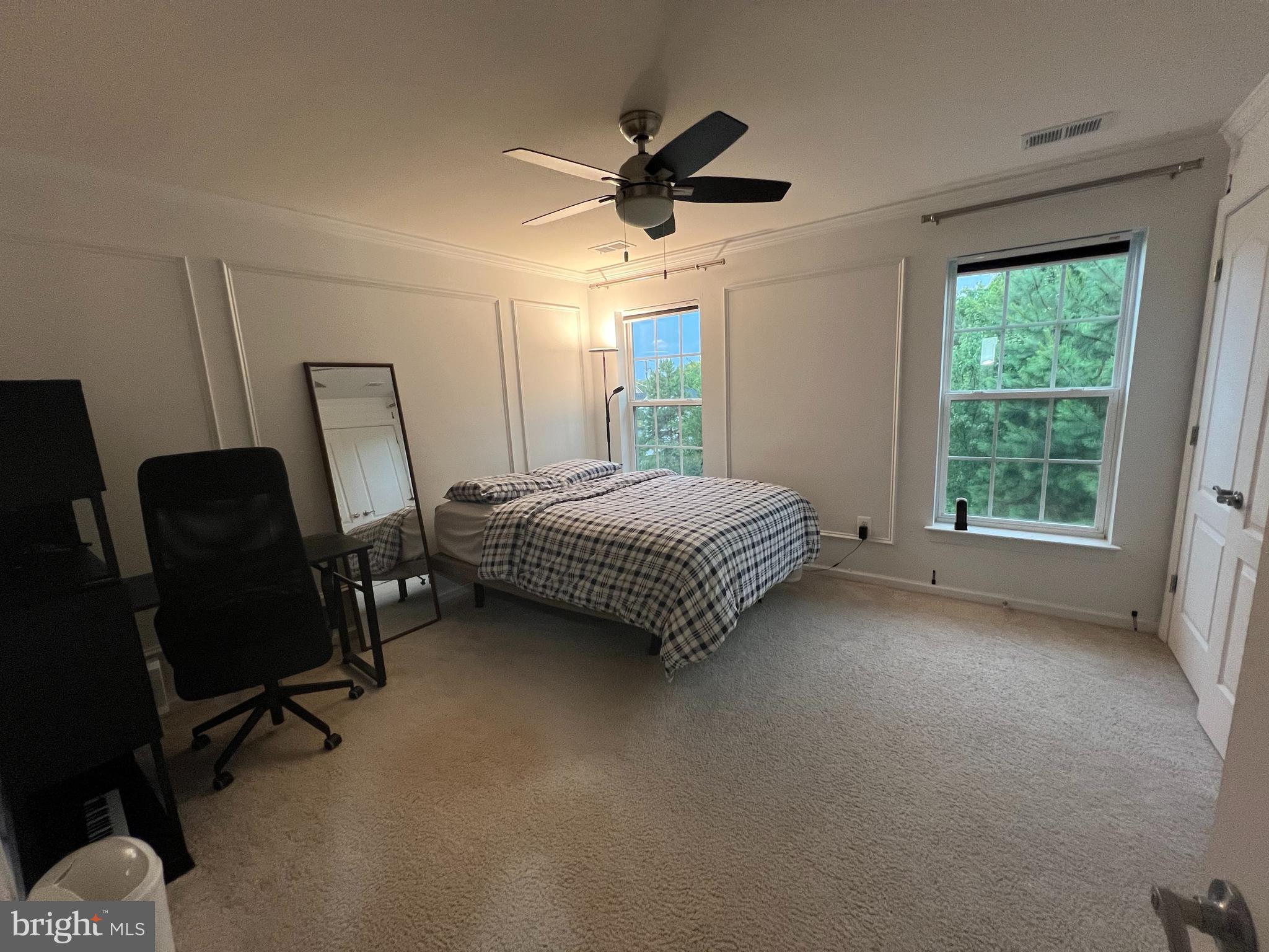 8193 Falls Grove Drive Manassas, VA 20111 - Photo 23 of 27 a living room with a bed furniture and a window