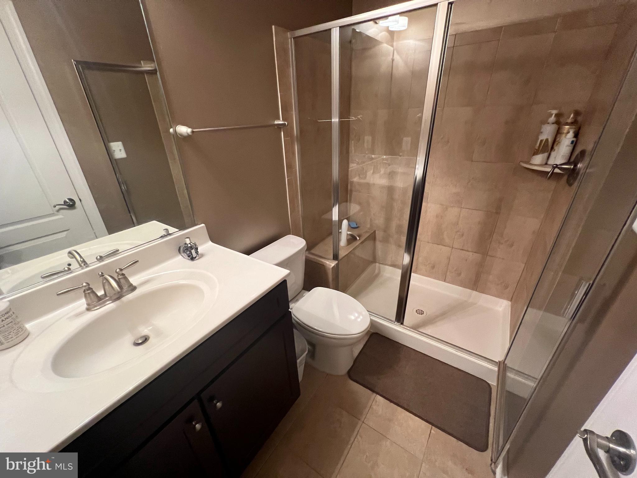 8193 Falls Grove Drive Manassas, VA 20111 - Photo 24 of 27 a bathroom with a sink toilet and shower