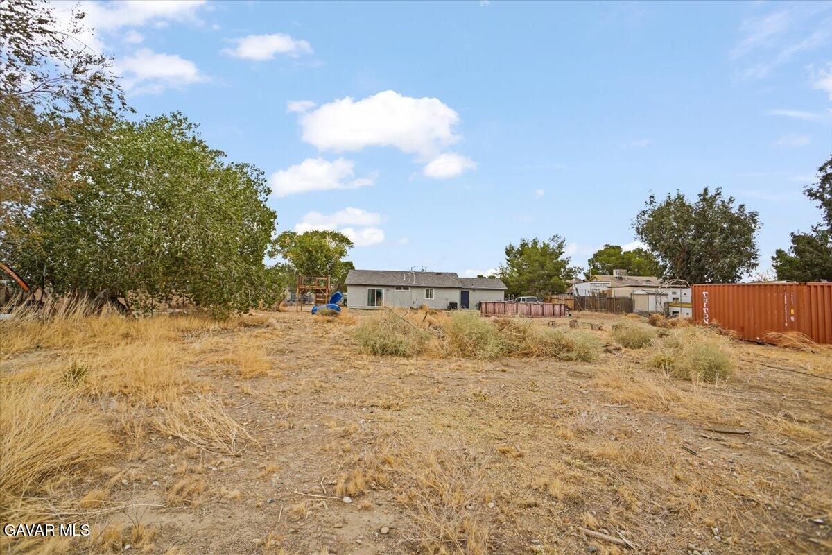 40287 Fieldspring Street Palmdale, CA 93591 - Photo 13 of 15 a street view with large trees