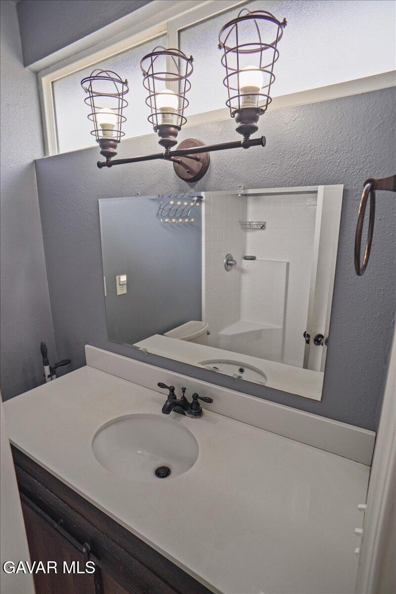 40287 Fieldspring Street Palmdale, CA 93591 - Photo 6 of 15 a bathroom with a sink and a mirror