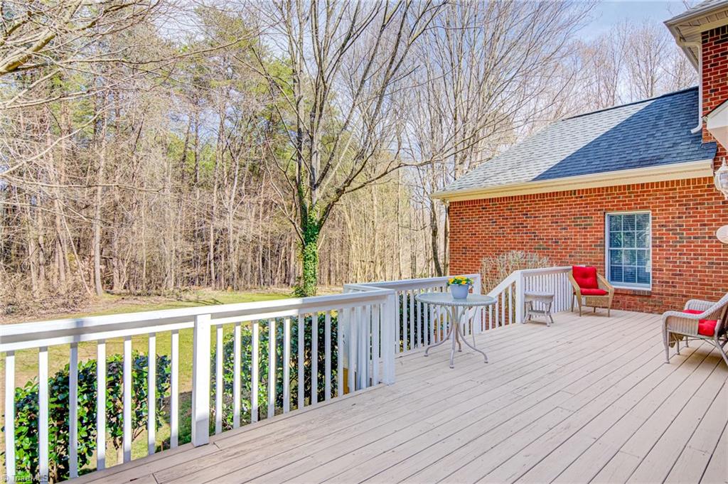 4511 Calabria Court High Point, NC 27265 - Photo 17 of 40 From the deck, you overlook the level back yard and woods beyond.