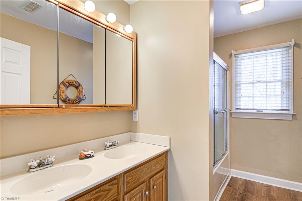 4511 Calabria Court High Point, NC 27265 - Photo 29 of 40 Double sinks in the upstairs bathroom that is conveniently located between upstairs bedrooms 1 and 2