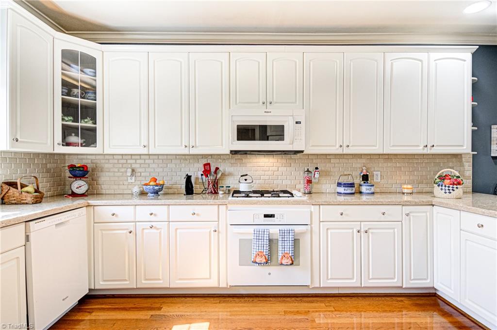 4511 Calabria Court High Point, NC 27265 - Photo 6 of 40 Remodeled kitchen with 42 inch upper cabinets for additional storage.