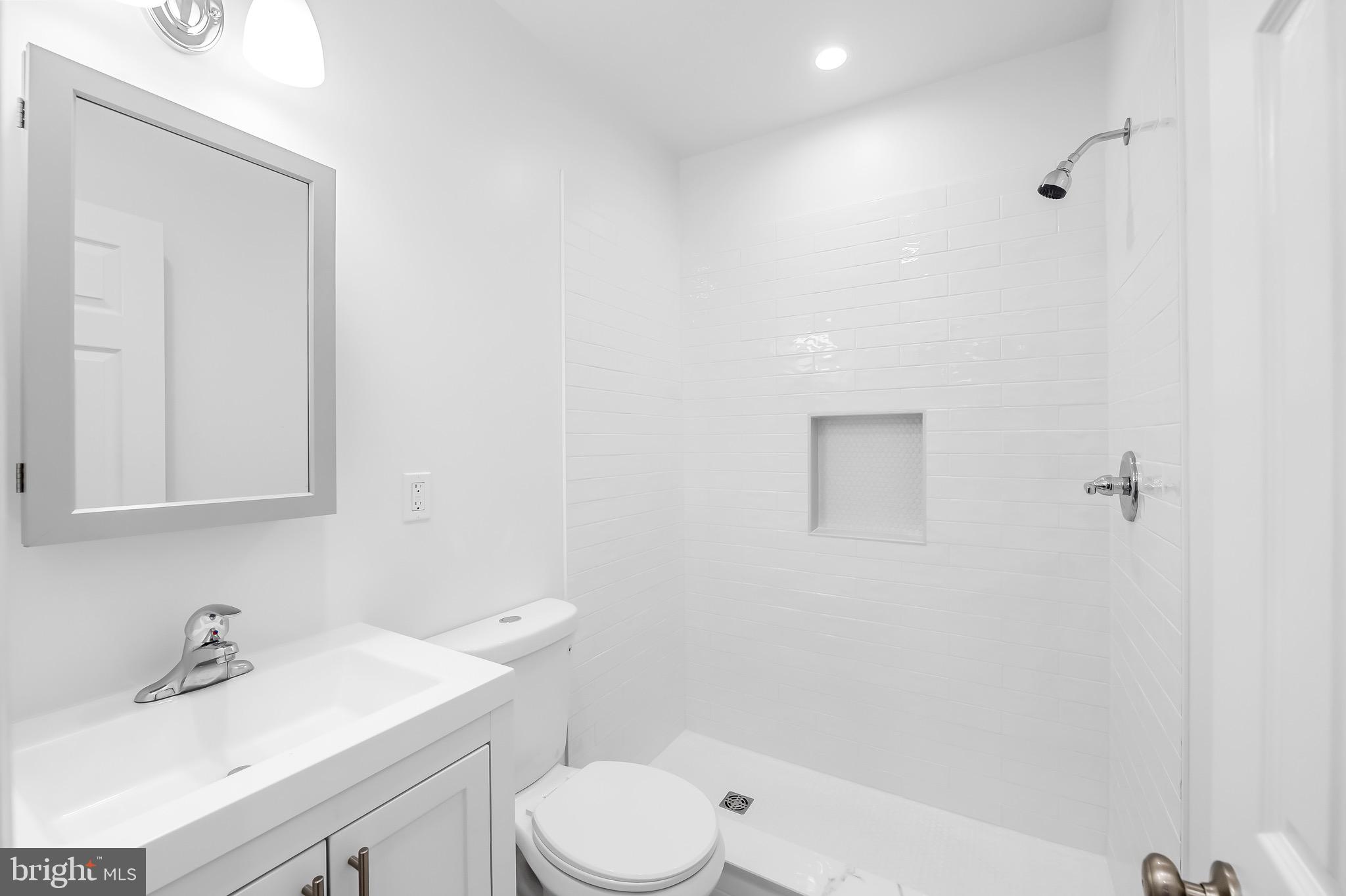 665 Washington Boulevard Baltimore, MD 21230 - Photo 12 of 21 a bathroom with a sink a toilet and shower