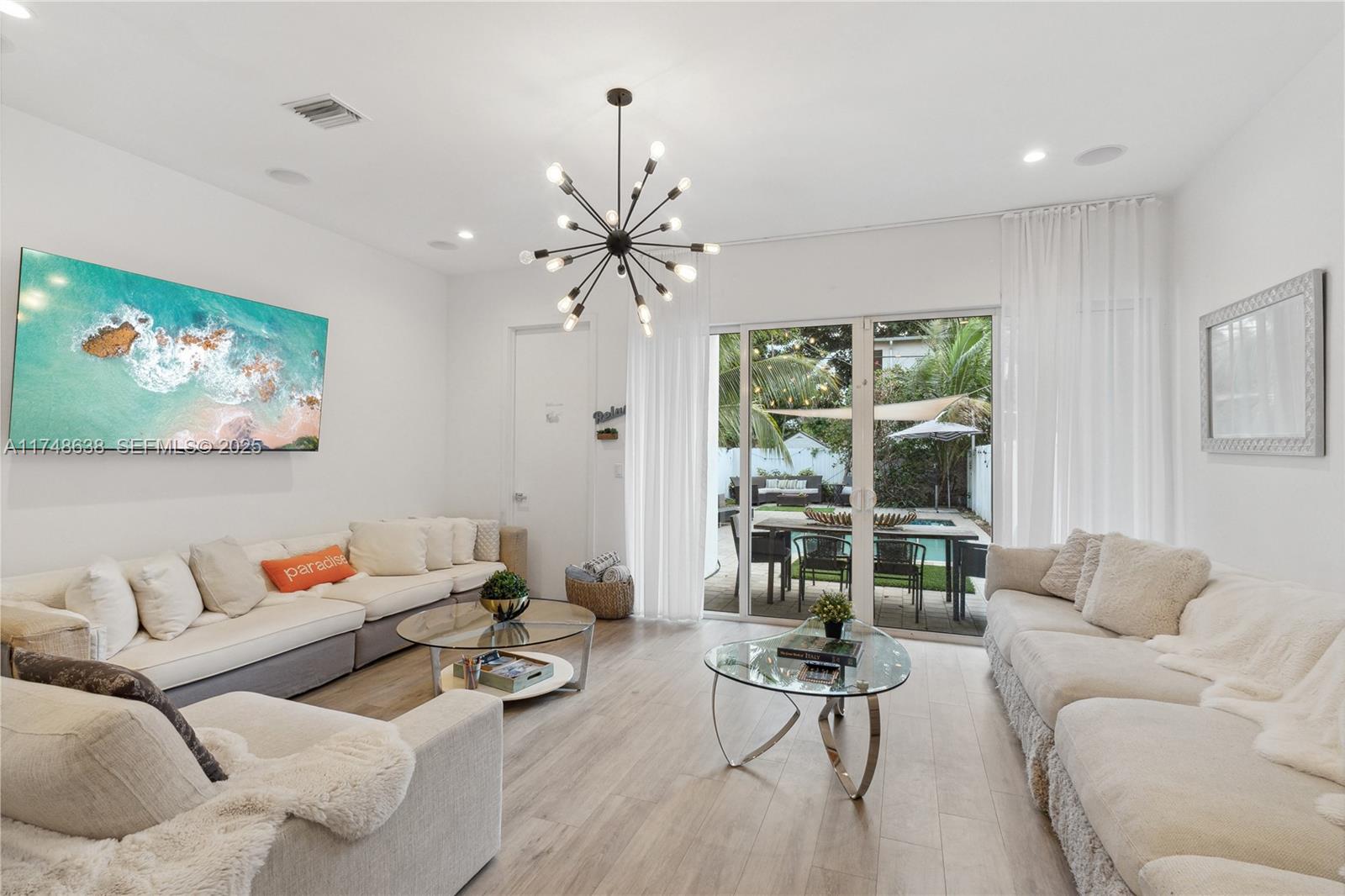 3575 Southwest 23rd Street, Unit 3575 Miami, FL 33145 - Photo 13 of 20 a living room with furniture and a flat screen tv