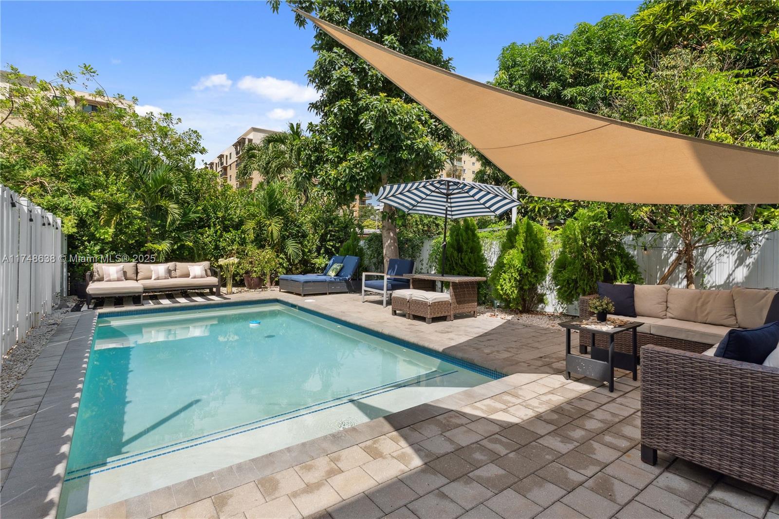 3575 Southwest 23rd Street, Unit 3575 Miami, FL 33145 - Photo 16 of 20 a view of swimming pool with outdoor seating and plants