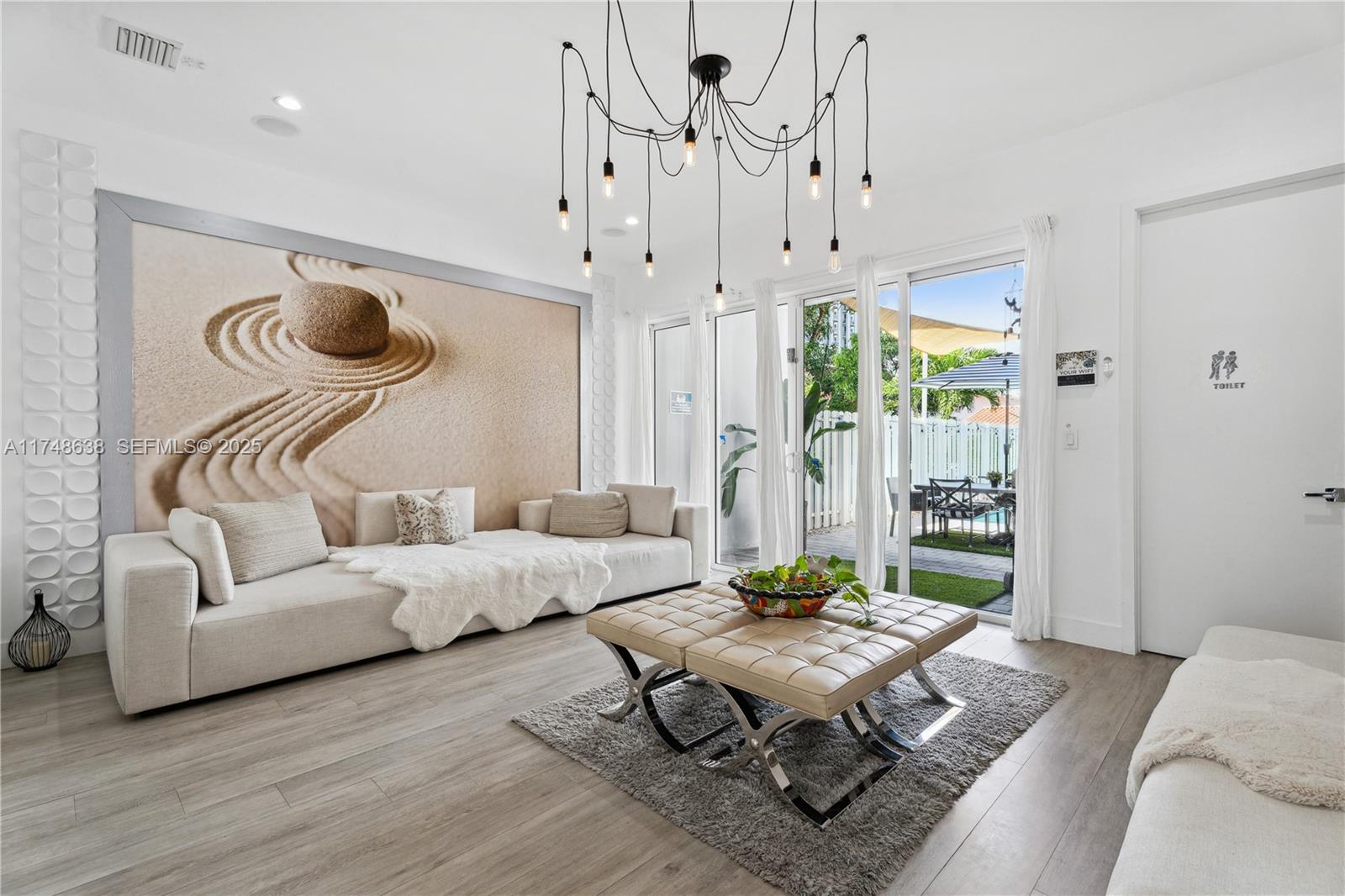 3575 Southwest 23rd Street, Unit 3575 Miami, FL 33145 - Photo 17 of 20 a living room with furniture and wooden floor