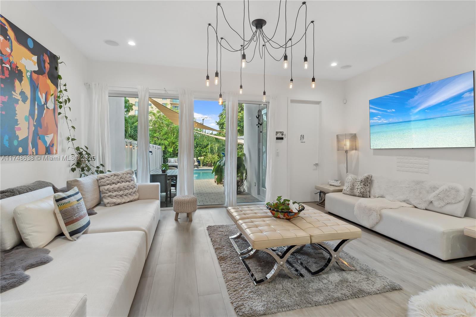 3575 Southwest 23rd Street, Unit 3575 Miami, FL 33145 - Photo 20 of 20 a living room with furniture and a large window