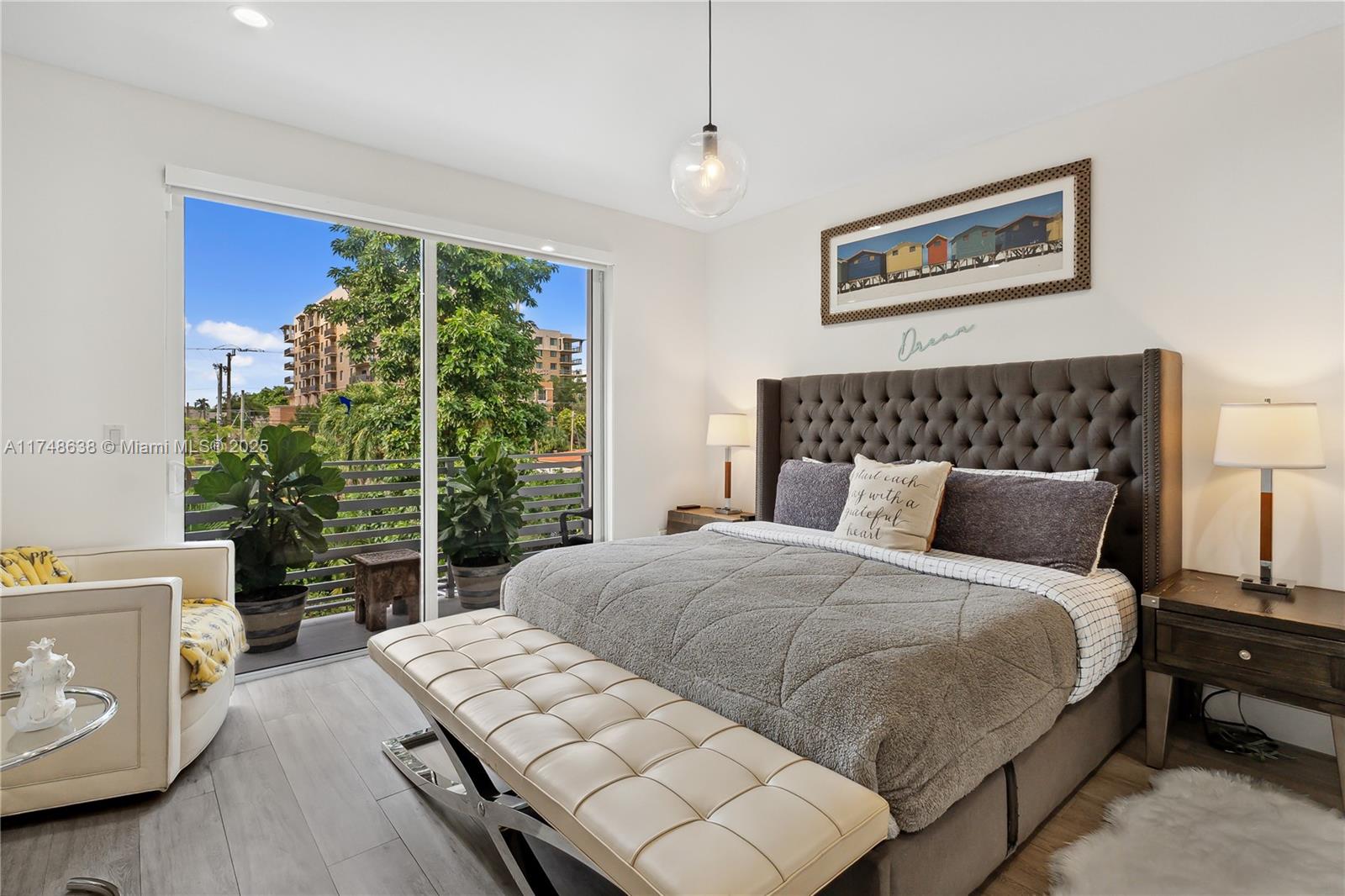 3575 Southwest 23rd Street, Unit 3575 Miami, FL 33145 - Photo 2 of 20 a bedroom with a large bed and a potted plant