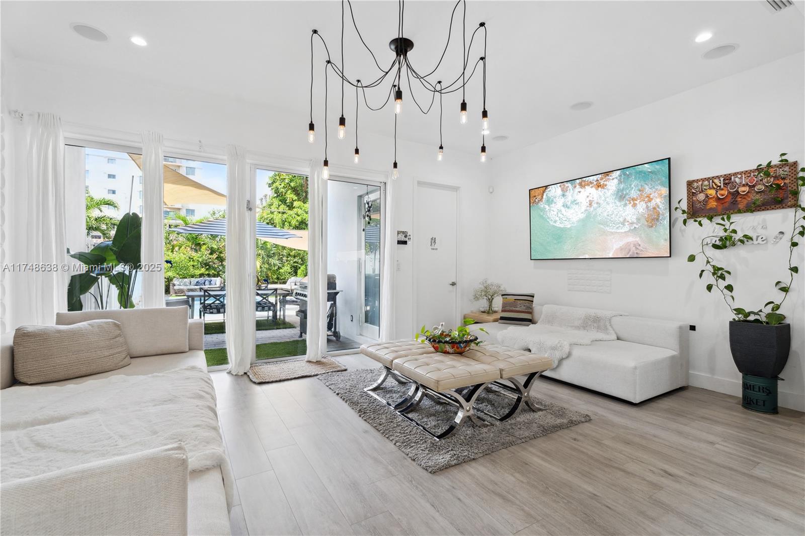 3575 Southwest 23rd Street, Unit 3575 Miami, FL 33145 - Photo 6 of 20 a living room with furniture and wooden floor