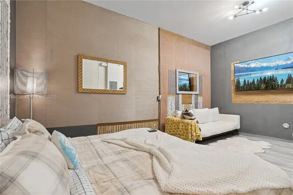 a bedroom with a bed and a couch