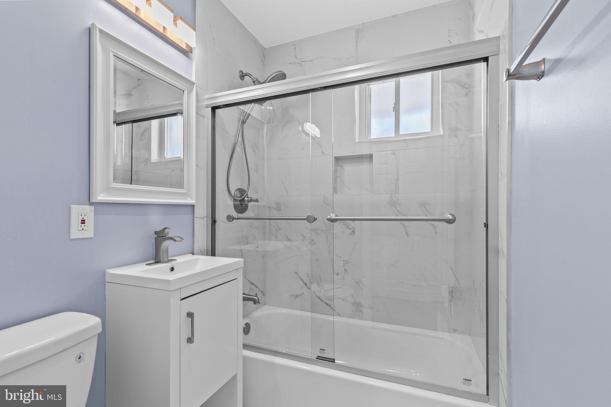 7602 Oxman Road Landover, MD 20785 - Photo 11 of 17 a bathroom with a sink toilet and shower