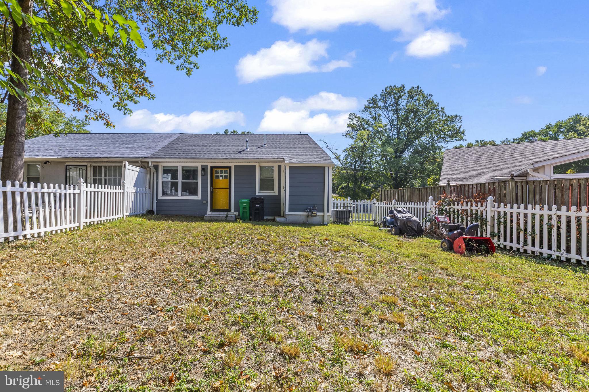 7602 Oxman Road Landover, MD 20785 - Photo 14 of 17 a front view of a house with a garden
