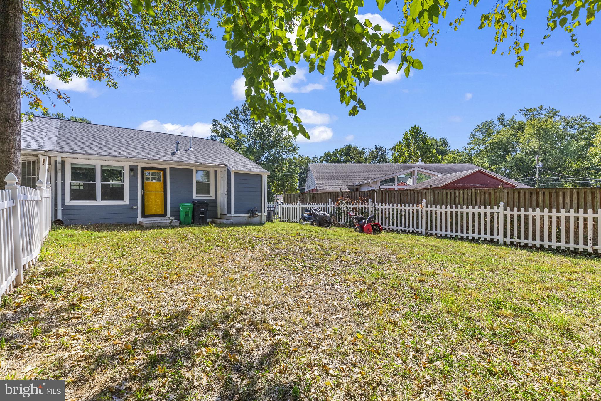 7602 Oxman Road Landover, MD 20785 - Photo 16 of 17 a view of a house with a small yard and a tree