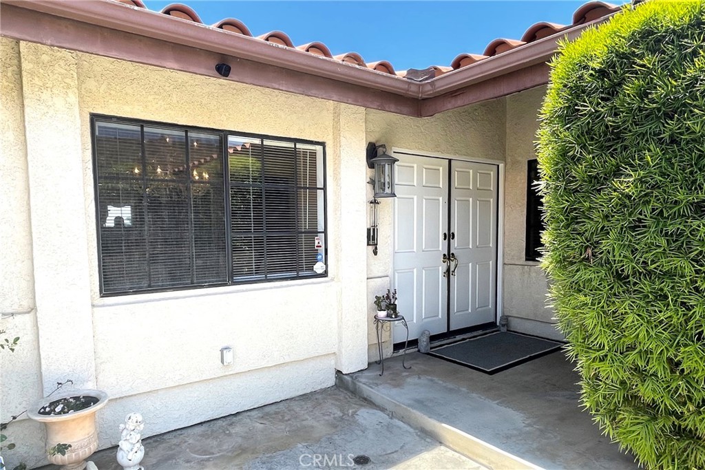 6508 Sandy Point Court Rancho Palos Verdes, CA 90275 - Photo 6 of 66 a view of a porch with a table and chair