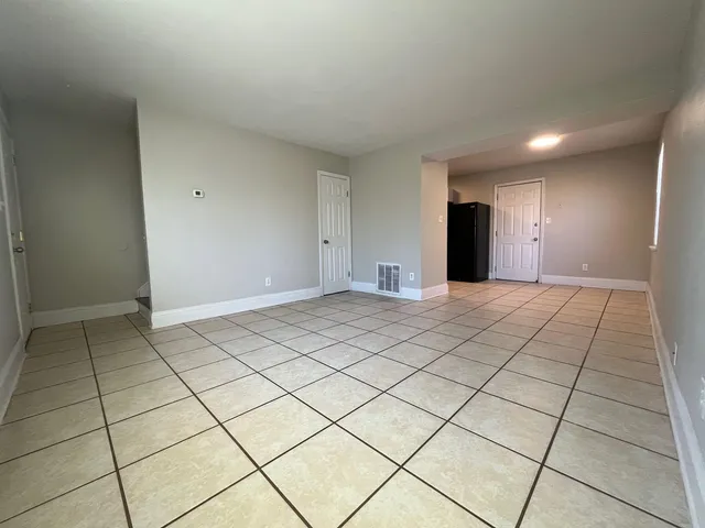 a view of an empty room and window