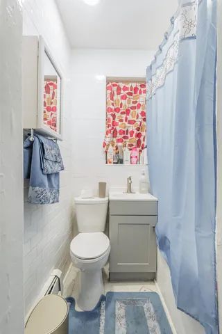 a bathroom with a toilet and a sink