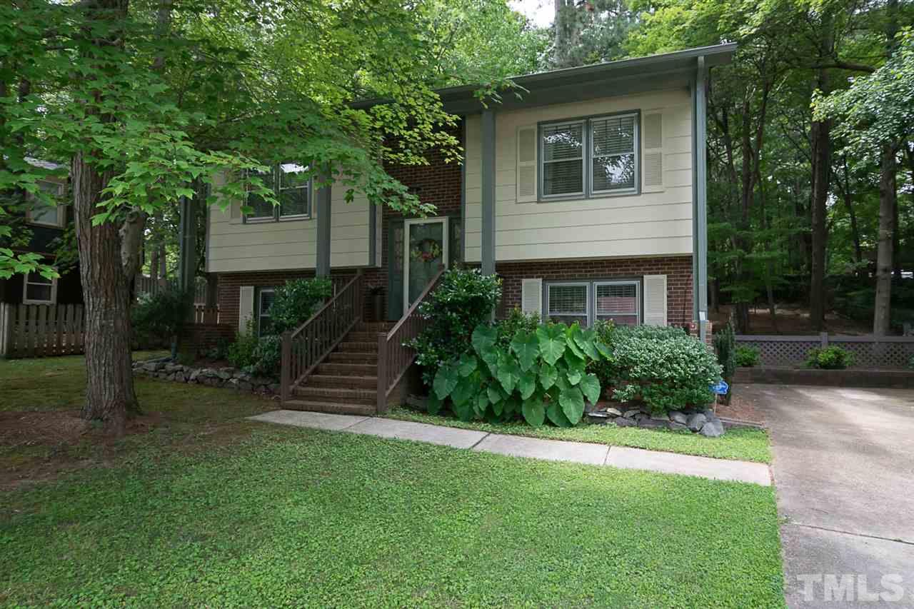 7713 Prospector Place Raleigh, NC 27615 - Photo 2 of 18 a front view of a house with a garden
