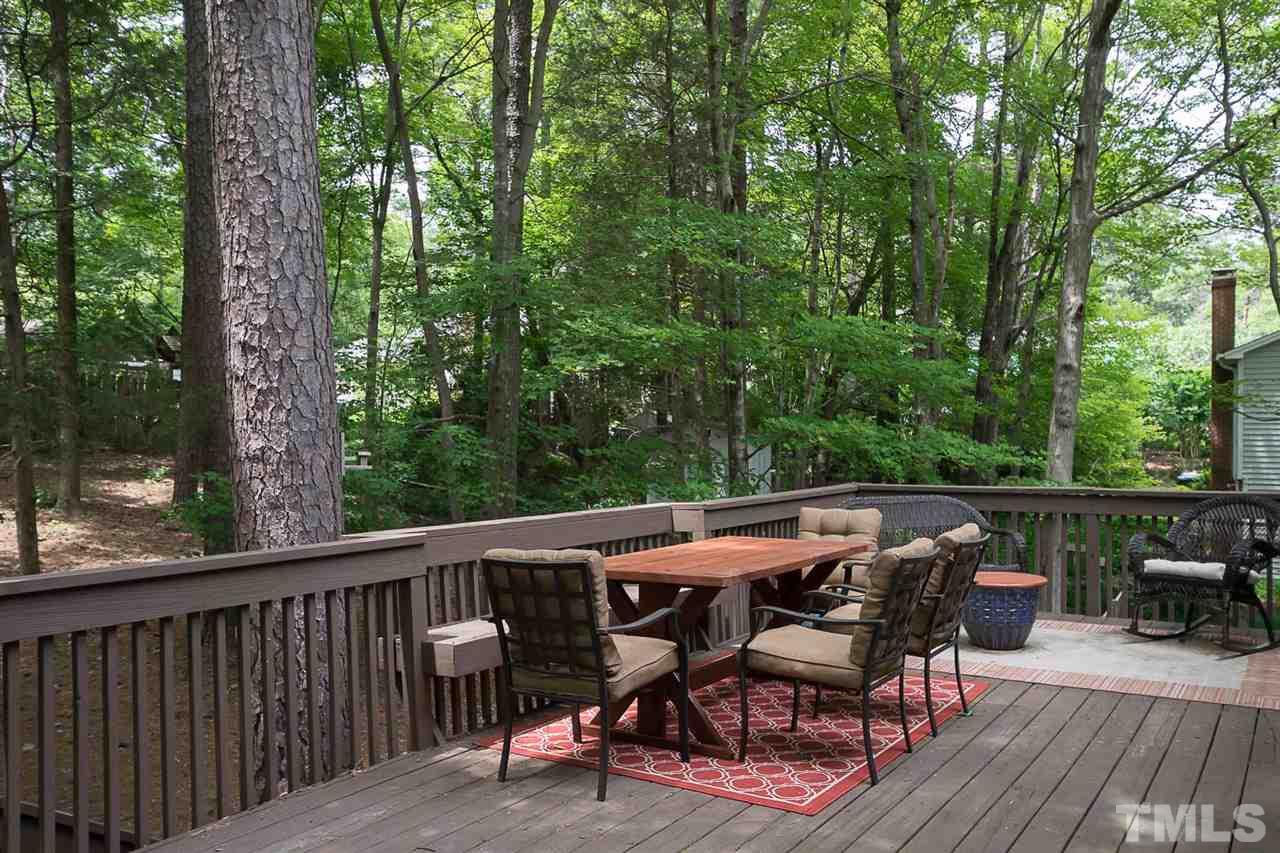 7713 Prospector Place Raleigh, NC 27615 - Photo 15 of 18 a view of backyard with hardwood and deck